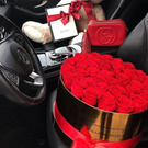 Flowers , candies , champagne and teddy bears